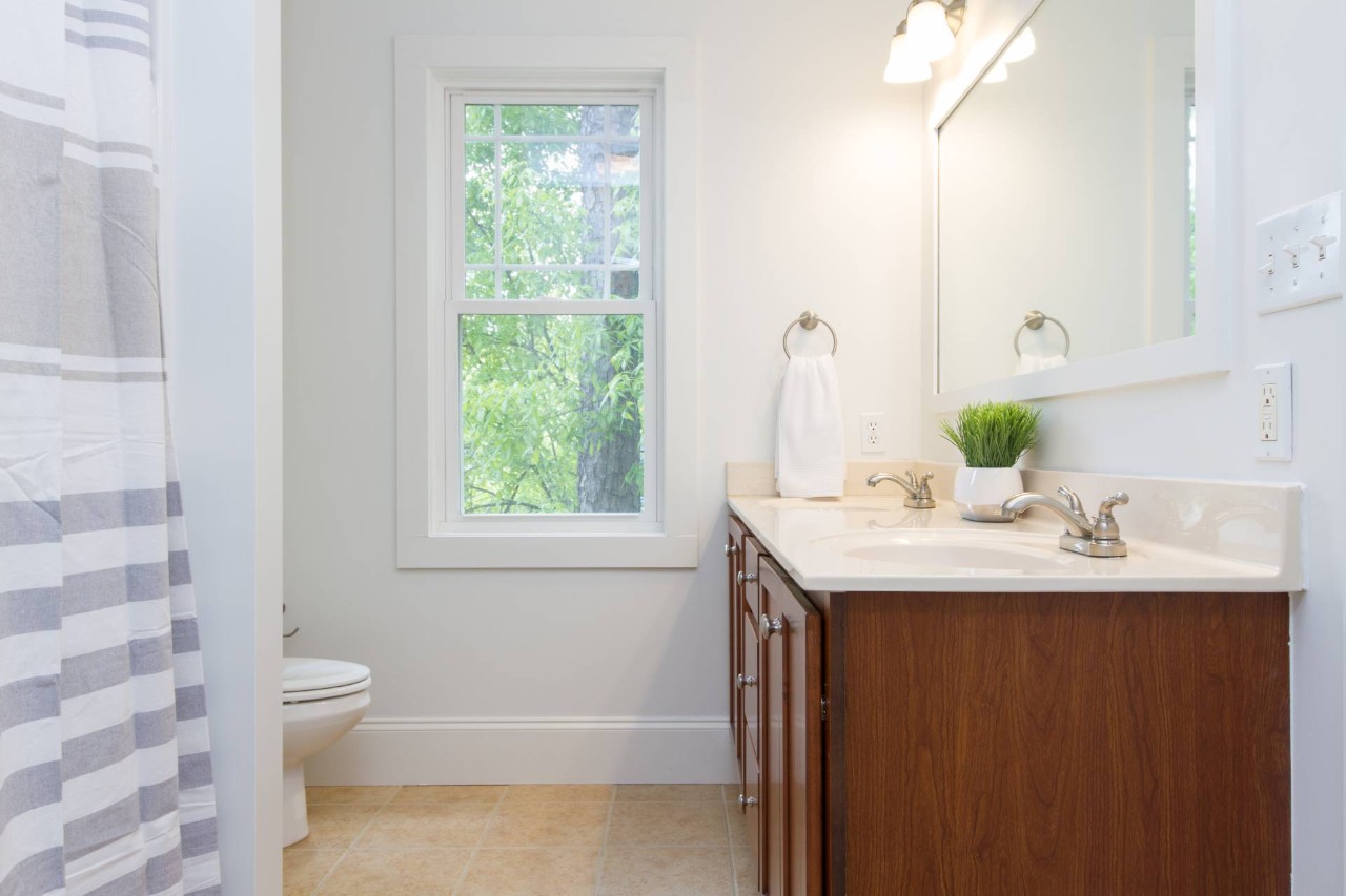 White window in a bathroom with a double vanity at Dale's AAA Blind Factory near Naples, FL