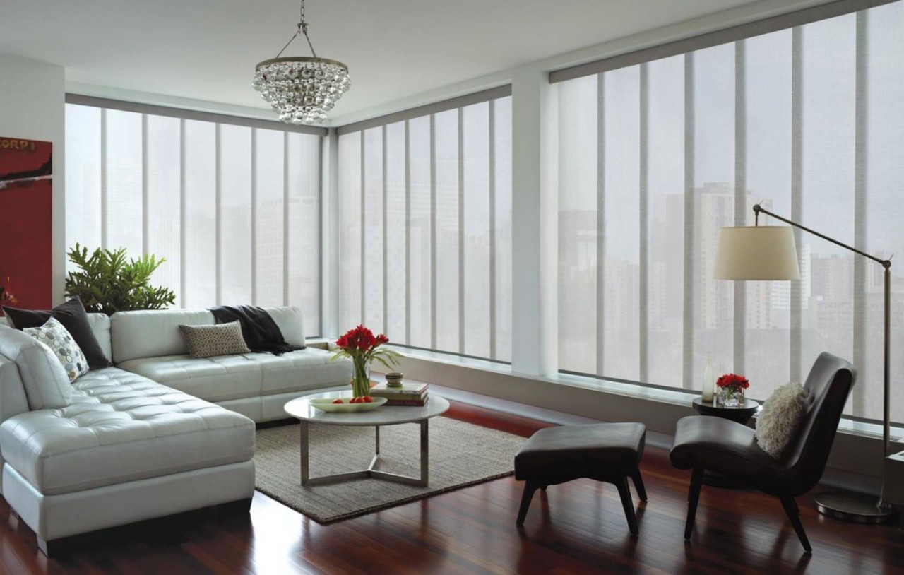 Modern Apartment living room decorated with Hunter Douglas Skyline® Panel Track Blinds near Naples, FL