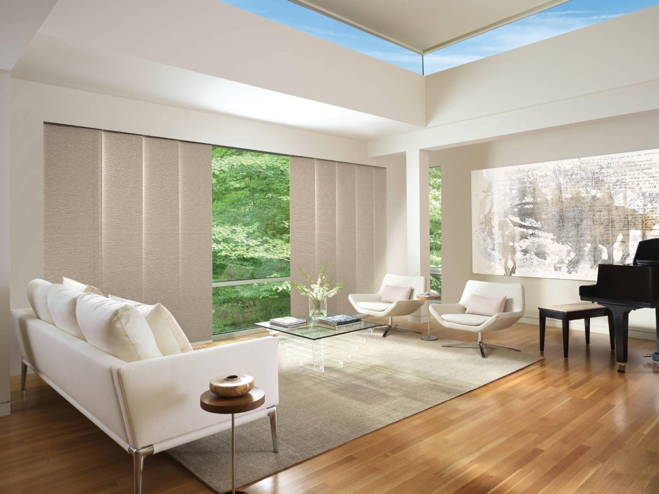 Hunter Douglas Skyline® Panel-Track Blinds as sliding door vertical blinds in a modern, neutral living room at Dale's AAA Blind Factory near Naples, FL