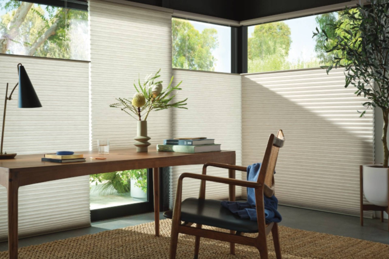 Stunning Hunter Douglas Top-Down/Bottom-Up Cellular Shades on large windows in a calming home office near Naples, FL