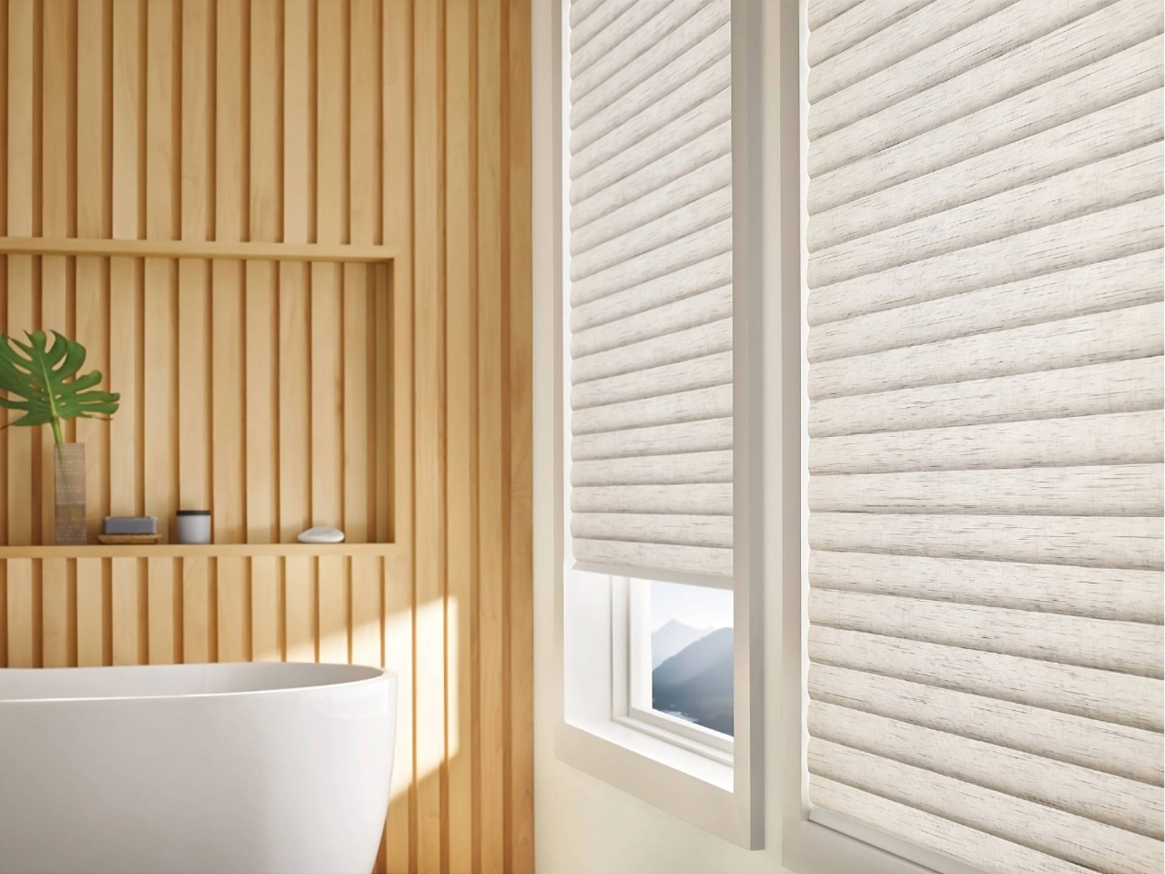 A stand-alone tub next to automated window shades and a Pebble® Remote on the shelf at Dale's AAA Blind Factory near Naples, (FL)